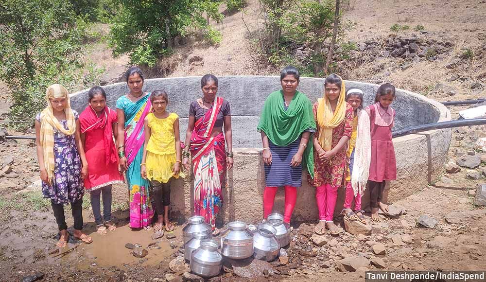Villagers Collecting Water from Community Government Water Storage