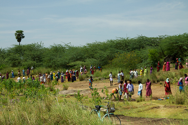 Rural villages digging out a silted-up water tank